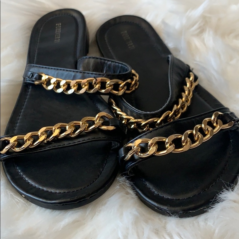 Black slippers with gold chains